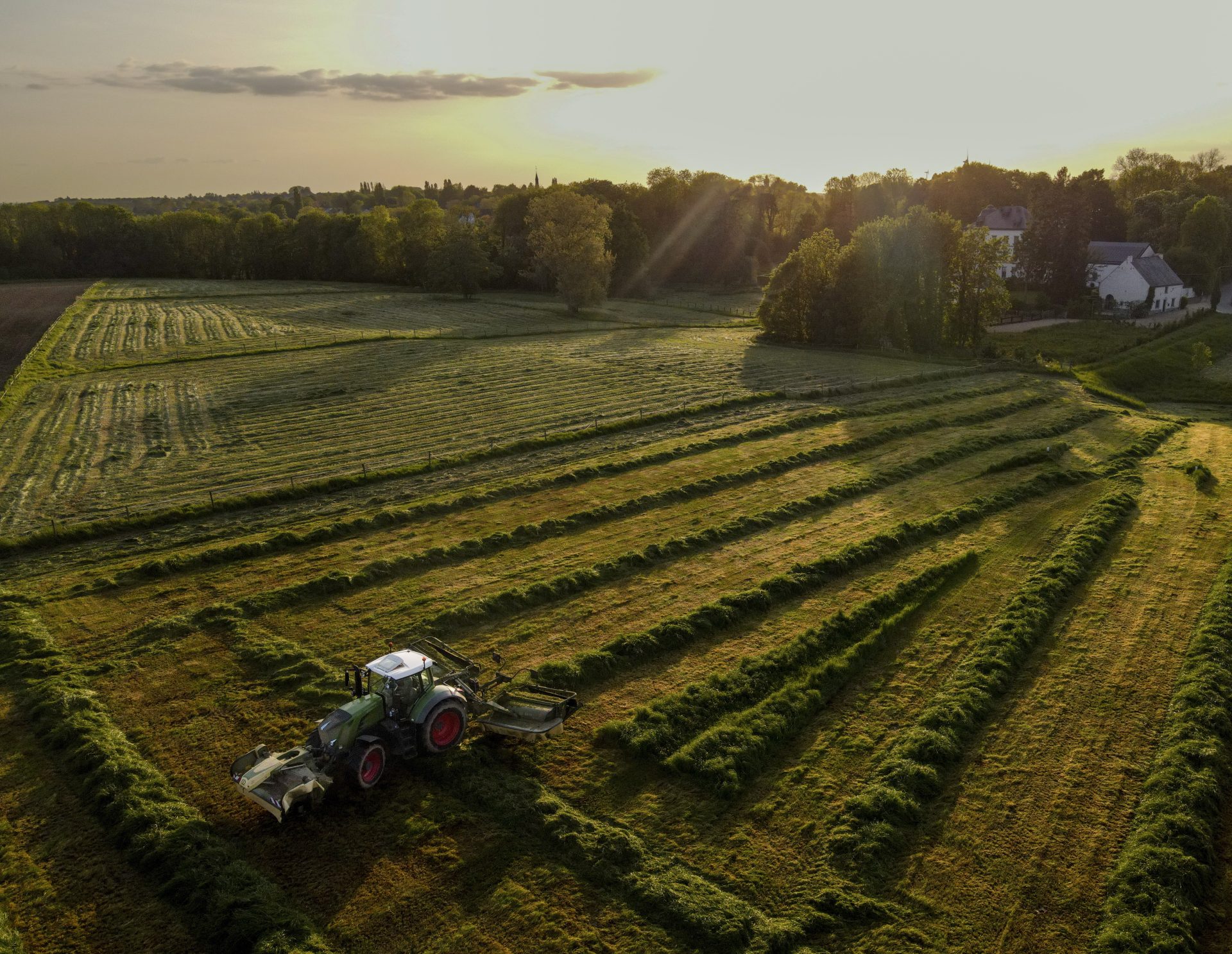 Namur (Belgium), 17/05/2023.- A drone view shows a farmer cutting the tall grass with his tractor to make the first hay of the season in a field in Namur, southern Belgium, 17 May 2023. (Bélgica) EFE/EPA/OLIVIER HOSLET