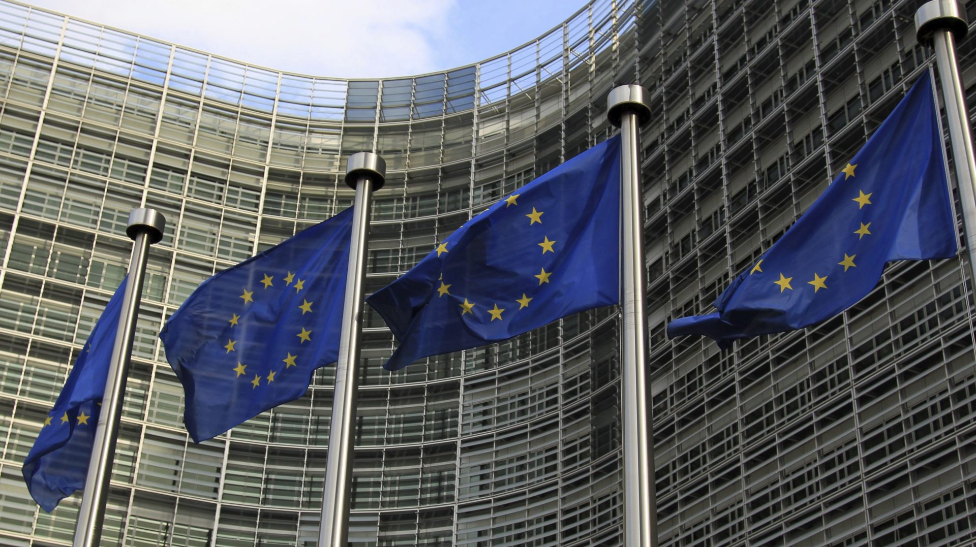 epa03430300 EU flags wave outside the EU Commission headquarters in Brussels, Belgium, 12 Ocotober 2012. The European Union was awarded the Nobel Peace Prize 2012 earlier the same day. The EU and its forerunners have for 'over six decades contributed to the advancement of peace and reconciliation, democracy and human rights in Europe,' the Norwegian Nobel Committee citation said 12 October. European Council President Herman van Rompuy said that the Nobel Peace Prize was a recognition of the EU's work as a peacemaker in Europe. EPA/OLIVIER HOSLET