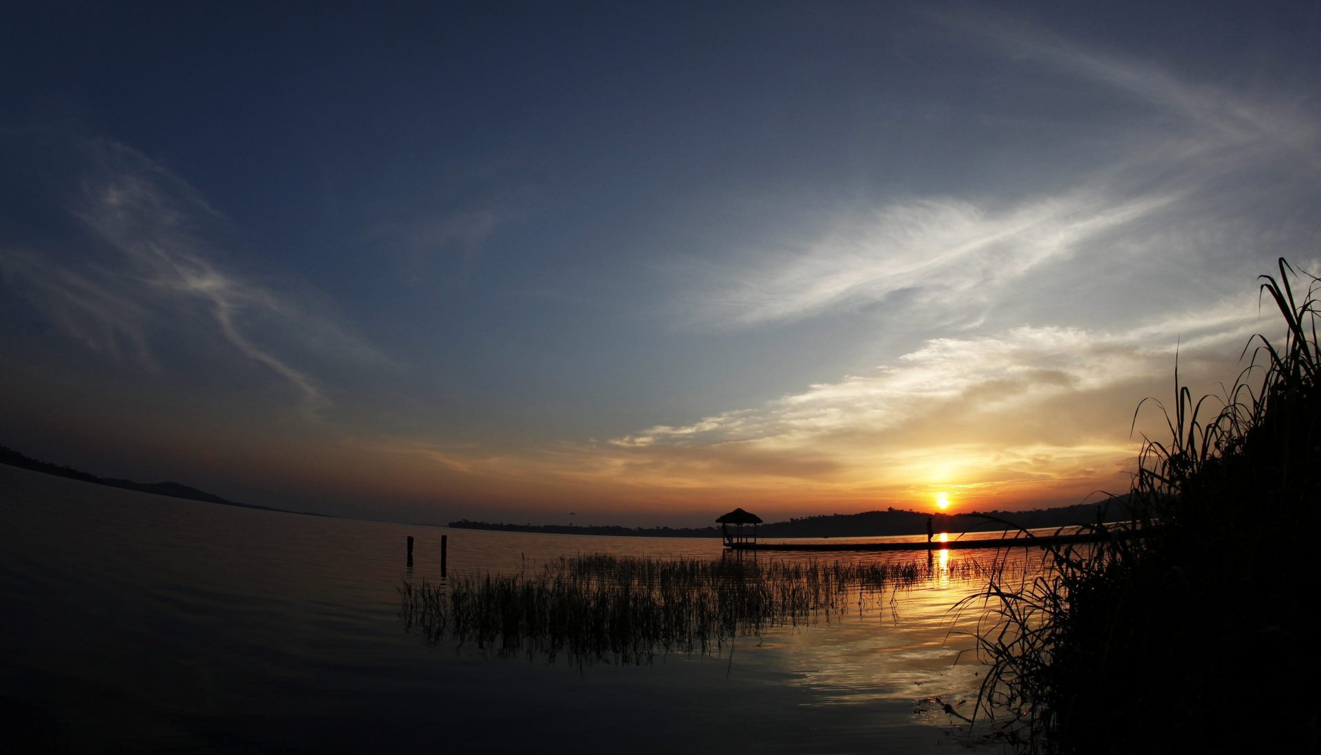 epa03447836 Picture taken with a fish eye lense shows the sun setting over Lake Victoria near Kampala, Uganda, 27 September 2012. The Victoria Lake is with 68.000 square kilometres by surface area the largest in Africa and the second largest freshwater lake in the world. Despite this it is rather shallow with a maximum depth of little more than 80 metres. EPA/GERNOT HENSEL