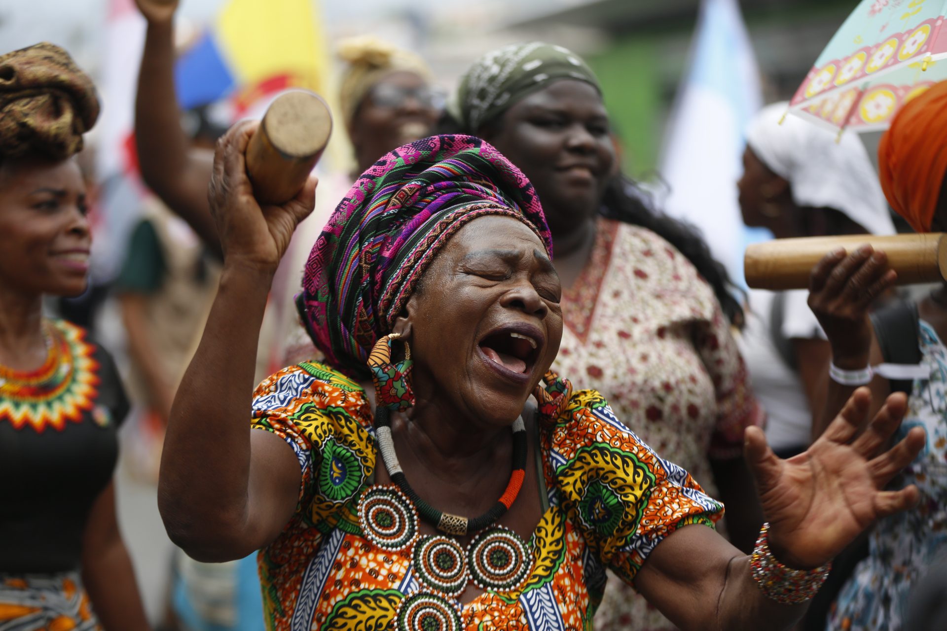 A woman sings during a march from Parque de las Banderas to the center of Cali, Colombia, 22 October 2024. With songs, dances, artistic displays and ancestral rituals, more than 1,000 people took to the streets of Cali to demand from the world entities that meet in the framework of COP16 "serious commitments" to protect nature and stop the loss of biodiversity. EFE/ Ernesto Guzmán