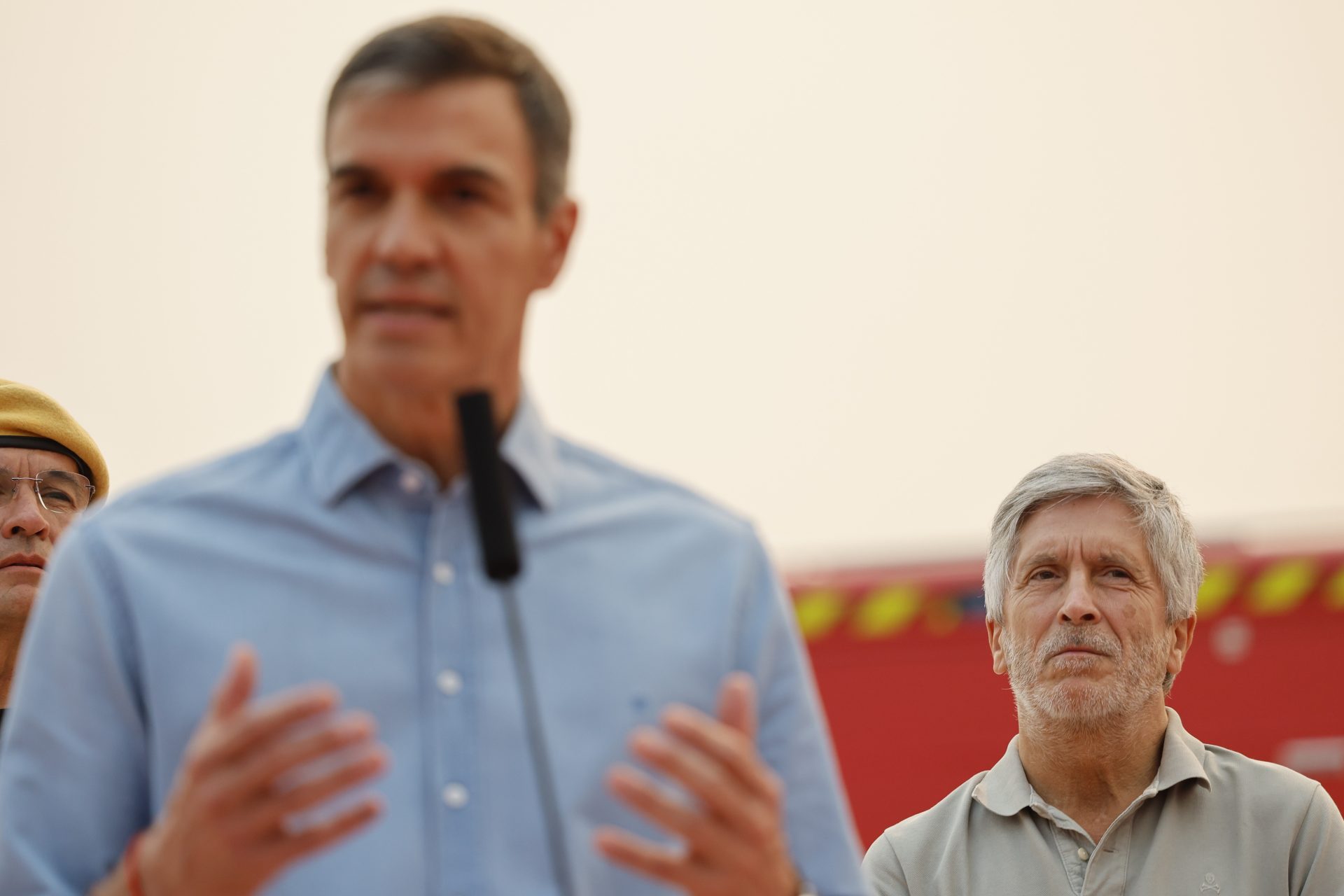 Spanish Home Affairs minister Fernando Grande-Marlaska (R) listens to Prime Minister Pedro Sanchez (L) during a press conference after his visit to the control center of the firefighters at the village of Cenicientos, Madrid, Spain on 25 July 2026. The several fires in Madrid's region have forced to move 60,000 inhabitants and have burnt 20,000 hectares. EFE/Mariscal